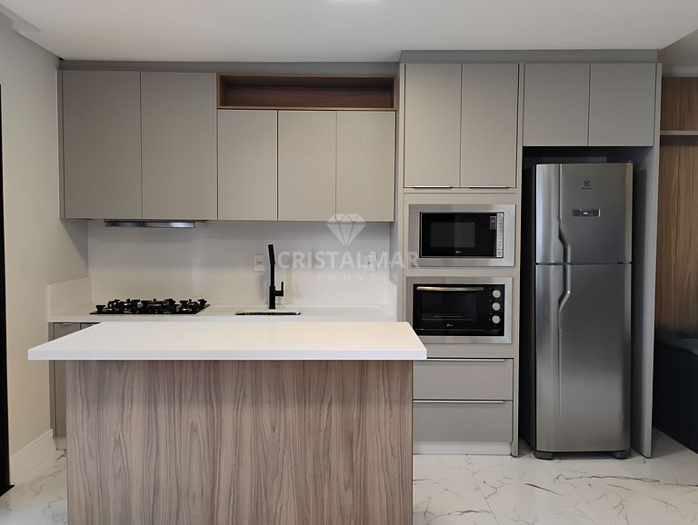 Apartamento em prédio com piscina na praia de Canto Grande